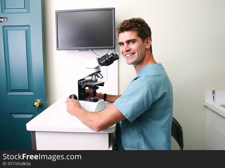 Doctor reviewing microscopic reports in vet clinic. Doctor reviewing microscopic reports in vet clinic