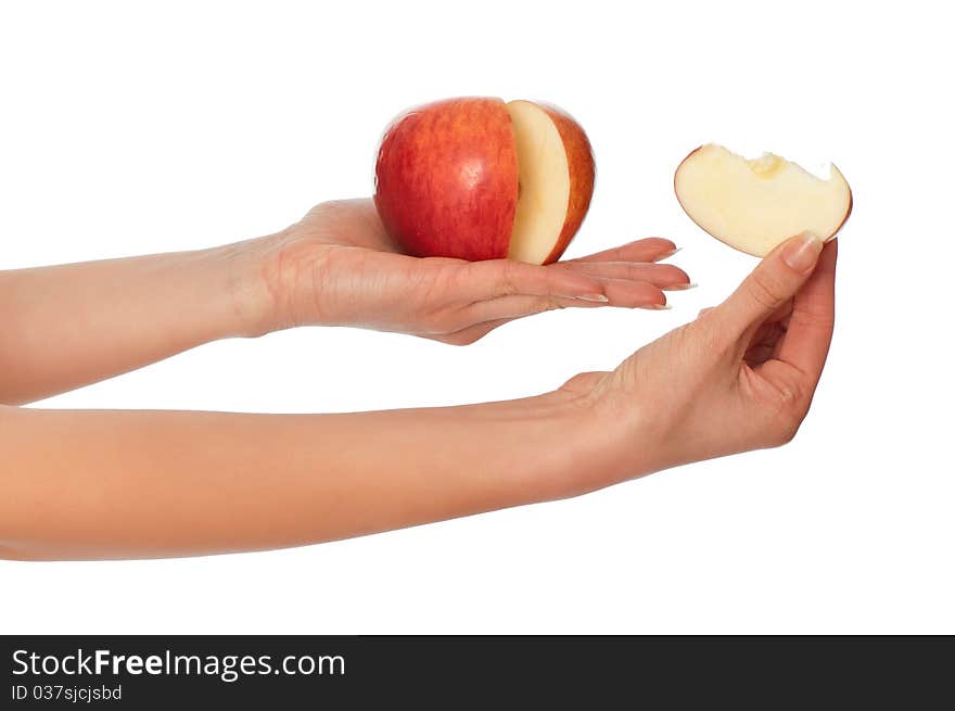 Woman holding in the hand one fresh red apple with a slice of apple