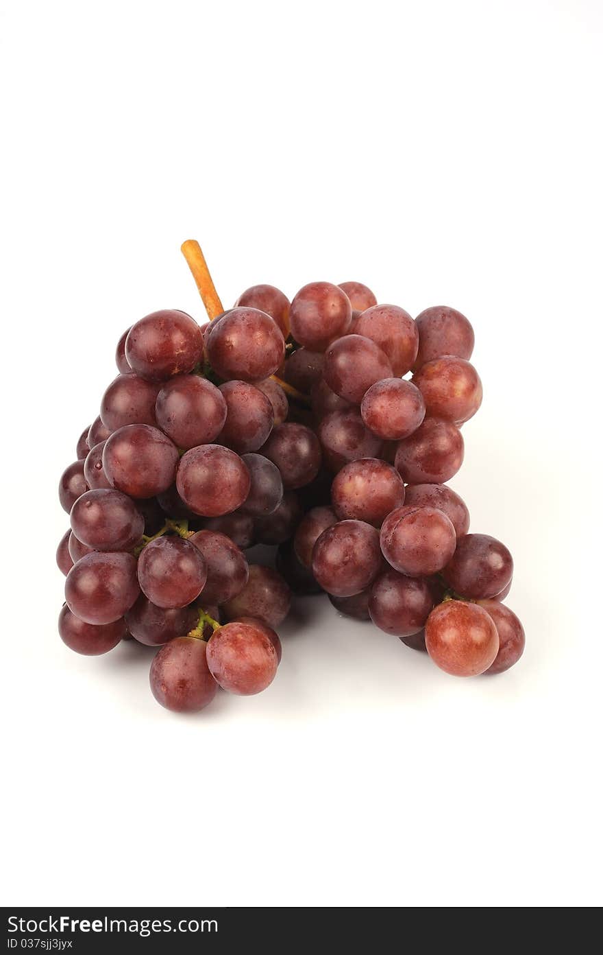 Red grapes isolated on white background.