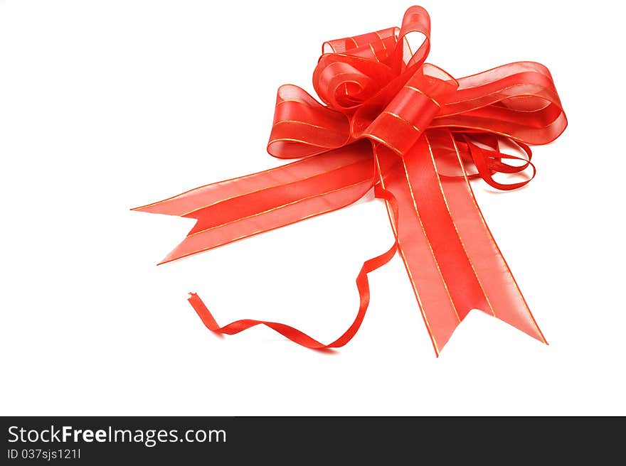 Red ribbon with bow isolated on white background.