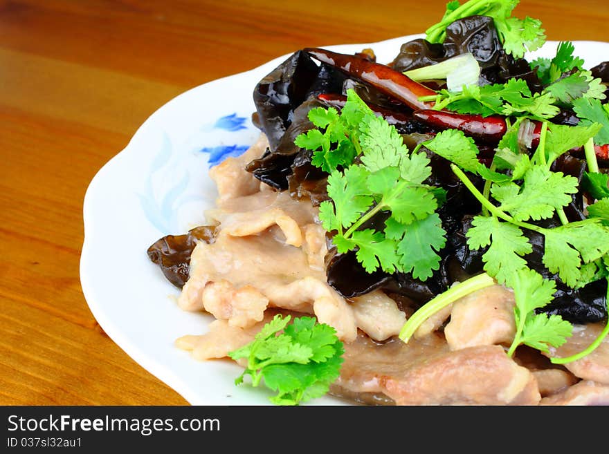 Chinese dish with pork, fungus and parsley