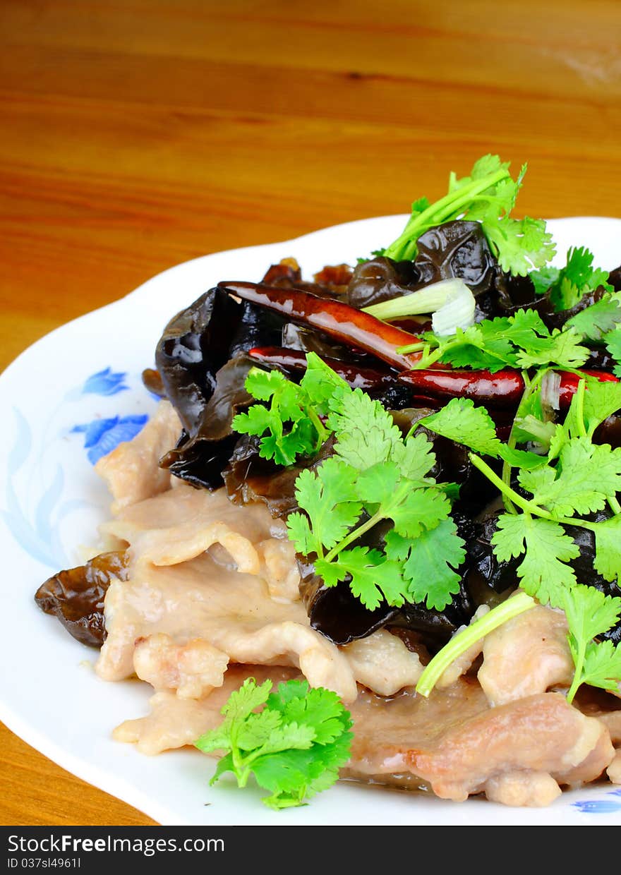 Chinese dish with pork, fungus and parsley