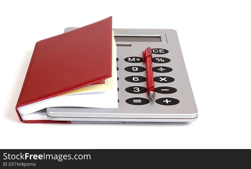 Great calculator and red notebook for reference daily notes with a pen on a white background