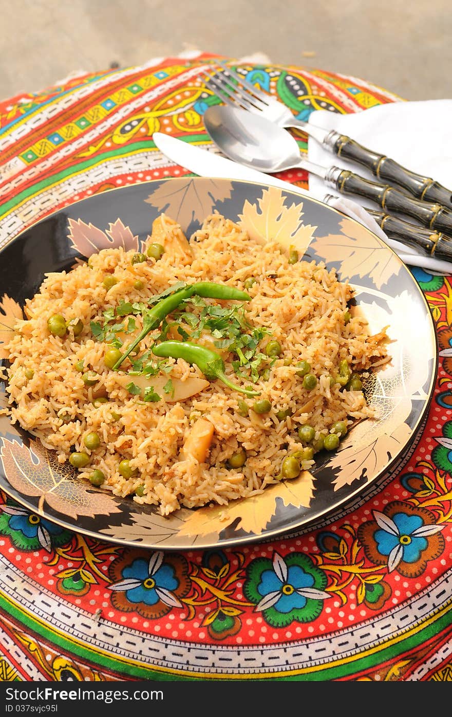 South Asian Traditional brown rice cooked with Potato, green peas, green chilies and tomatoes. South Asian Traditional brown rice cooked with Potato, green peas, green chilies and tomatoes.