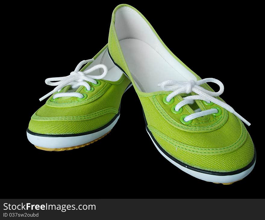 Light green fabric shoes on Black background