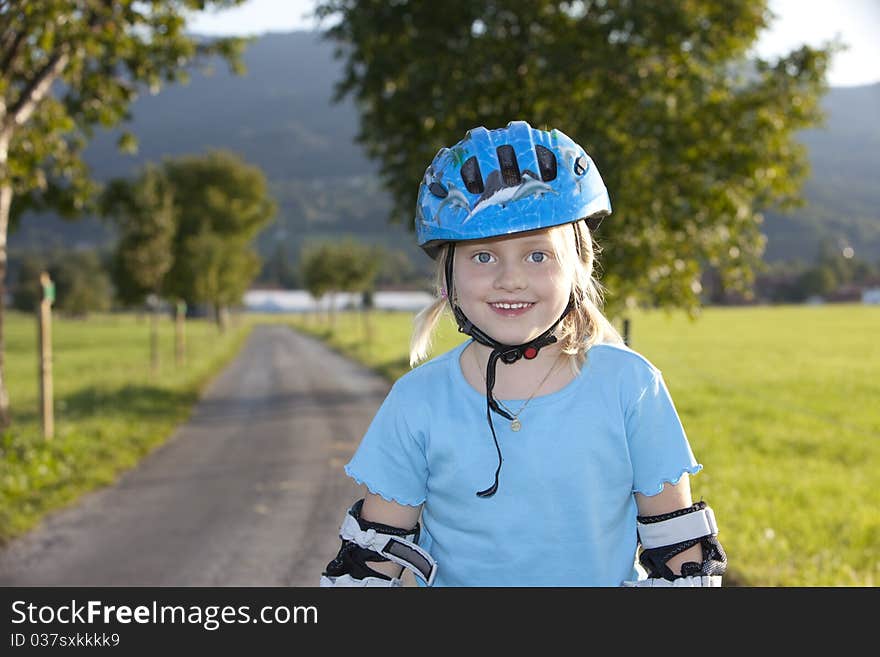 Young Beautiul Blond Girl Inline-skating Outdoor