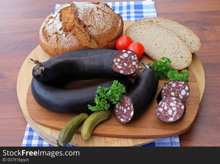 Home made black pudding on timber board