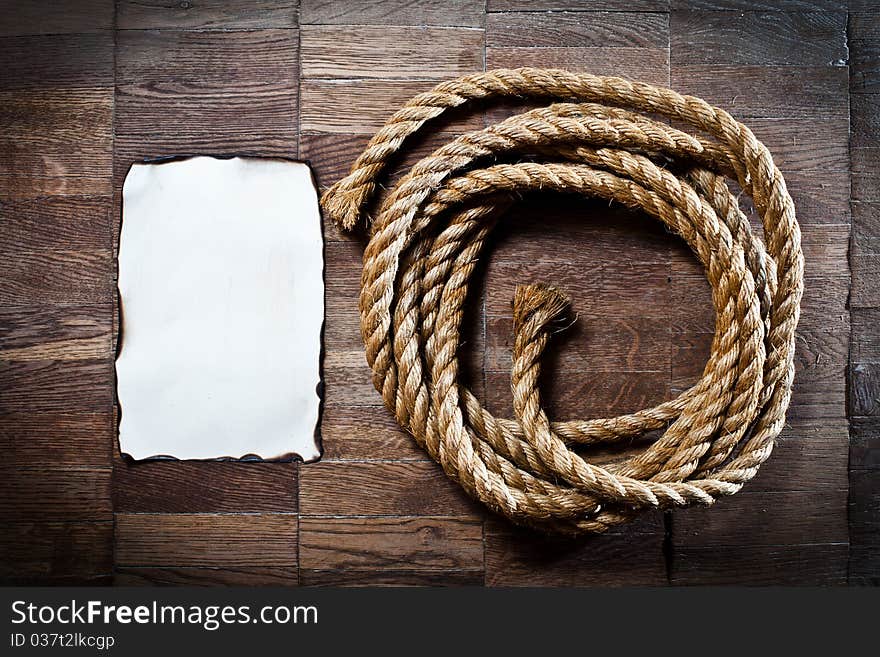 Texture of wooden boards with ship rope