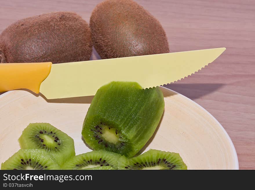 A delicious kiwi to cut and eating. A delicious kiwi to cut and eating