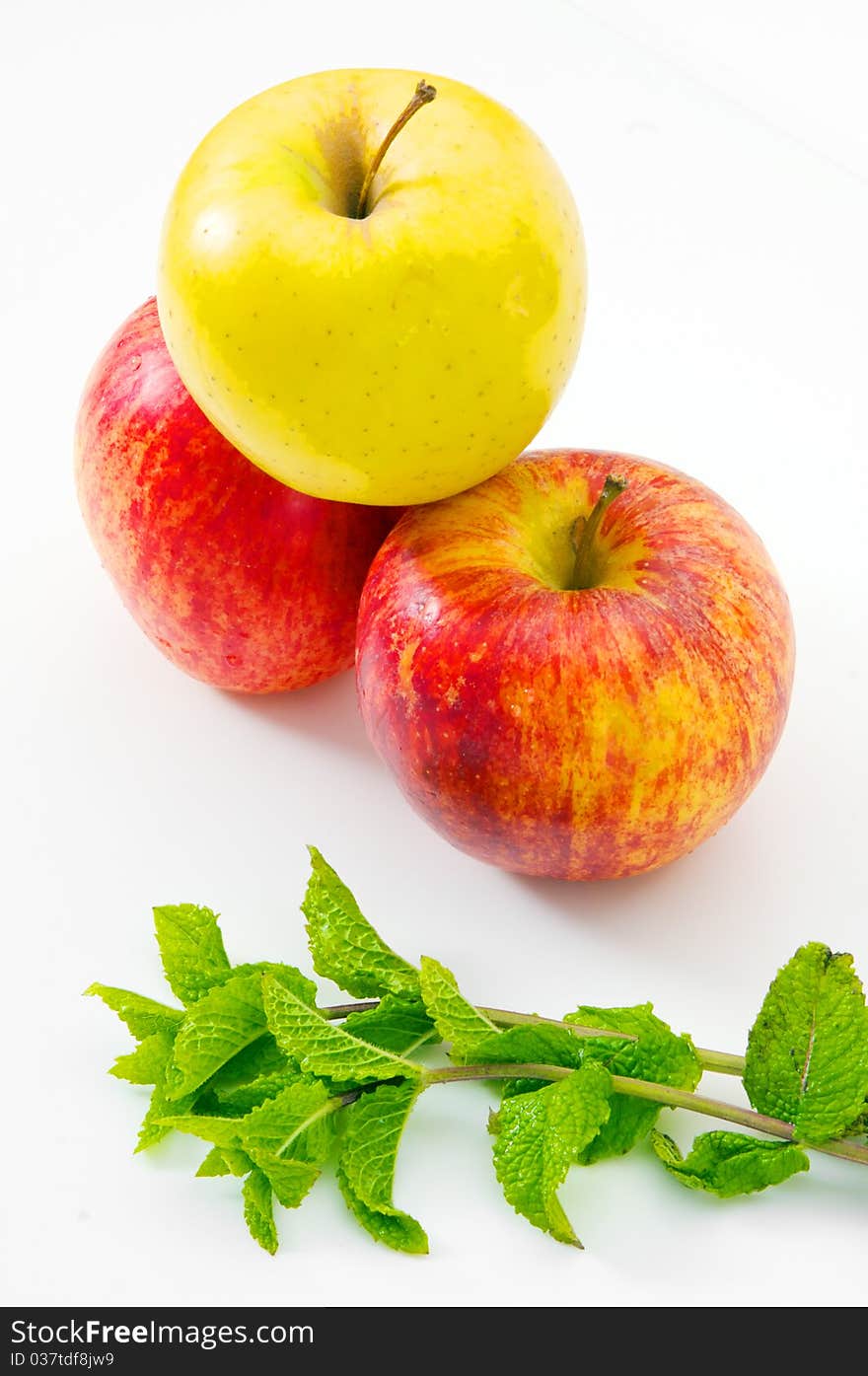 Apples with mint isolated on a white background. Apples with mint isolated on a white background