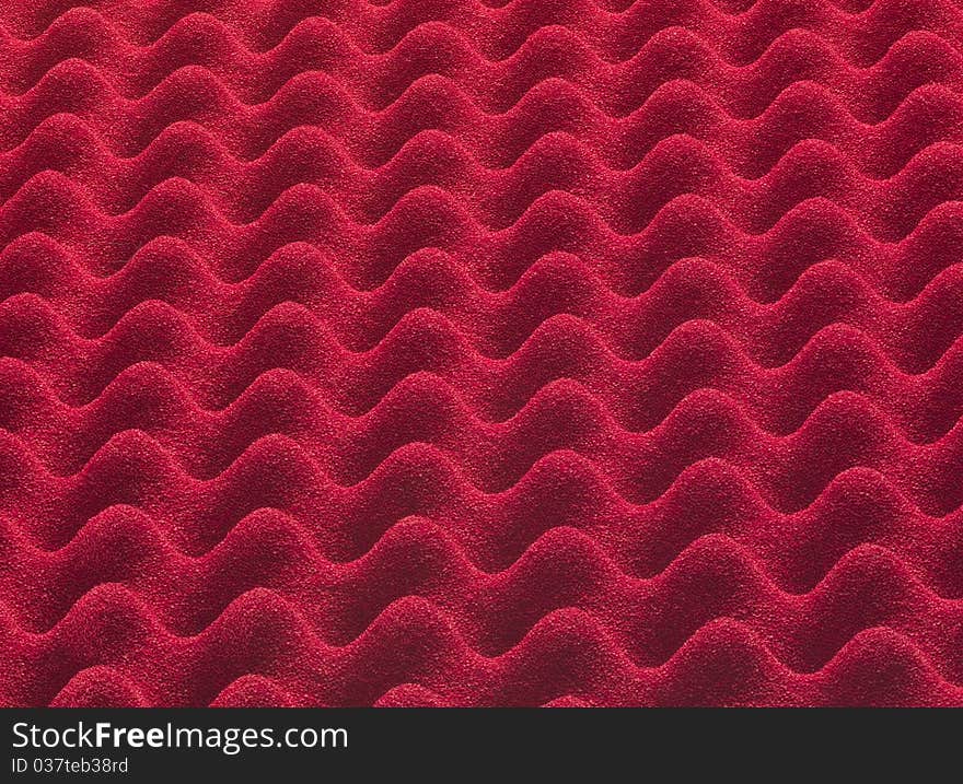 Red plastic insulating material, forming a texture macro photography. Red plastic insulating material, forming a texture macro photography