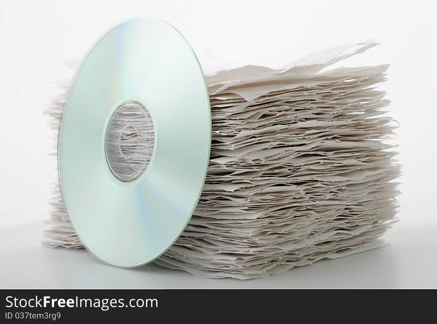 CD leaning against a stack of paper