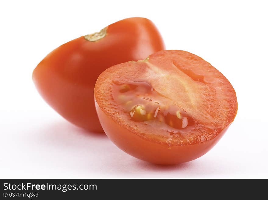 Fresh and red tomato, cut on white background. Fresh and red tomato, cut on white background