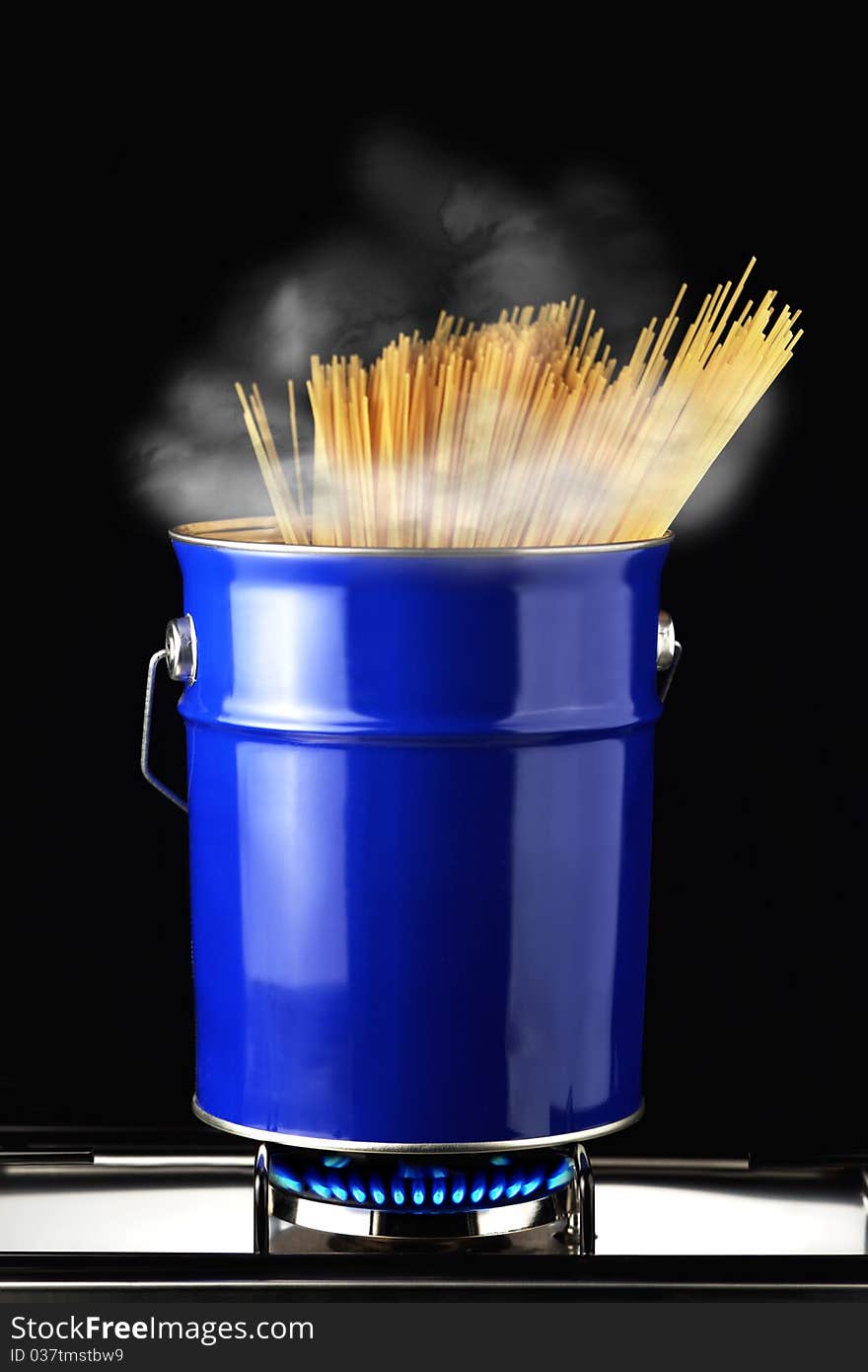 Spaghetti in blue saucepan with boiling water. Spaghetti in blue saucepan with boiling water