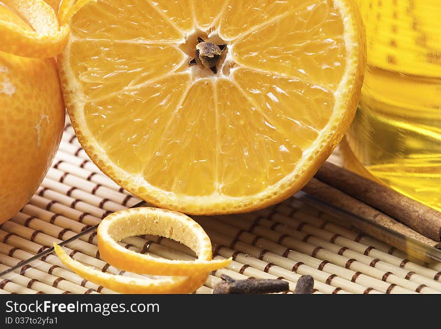 Close up halved orange with rose-apple