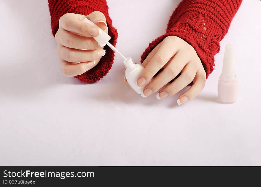 Woman holding white nail polish. Woman holding white nail polish