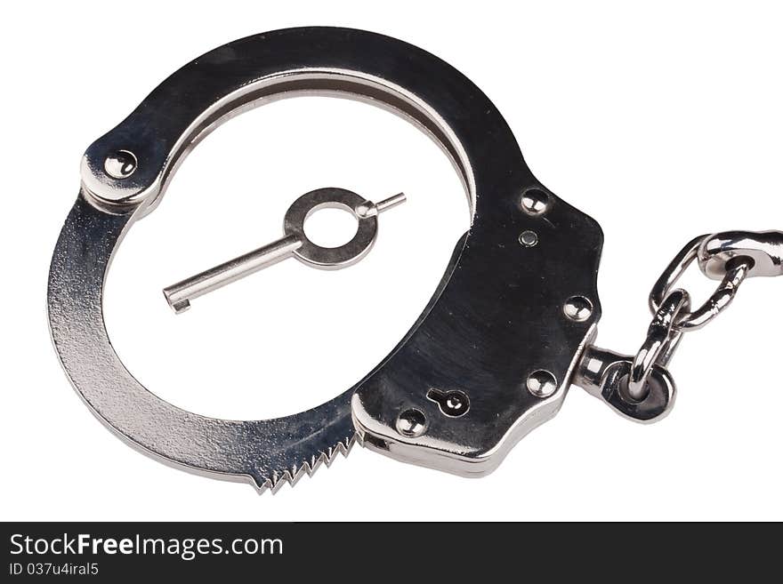 Closed iron handcuffs on a white background.