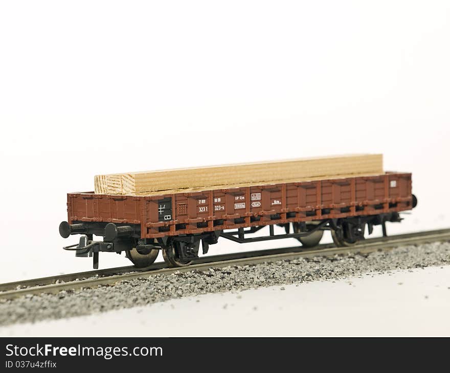 A platform wagon on rail isolated by white background