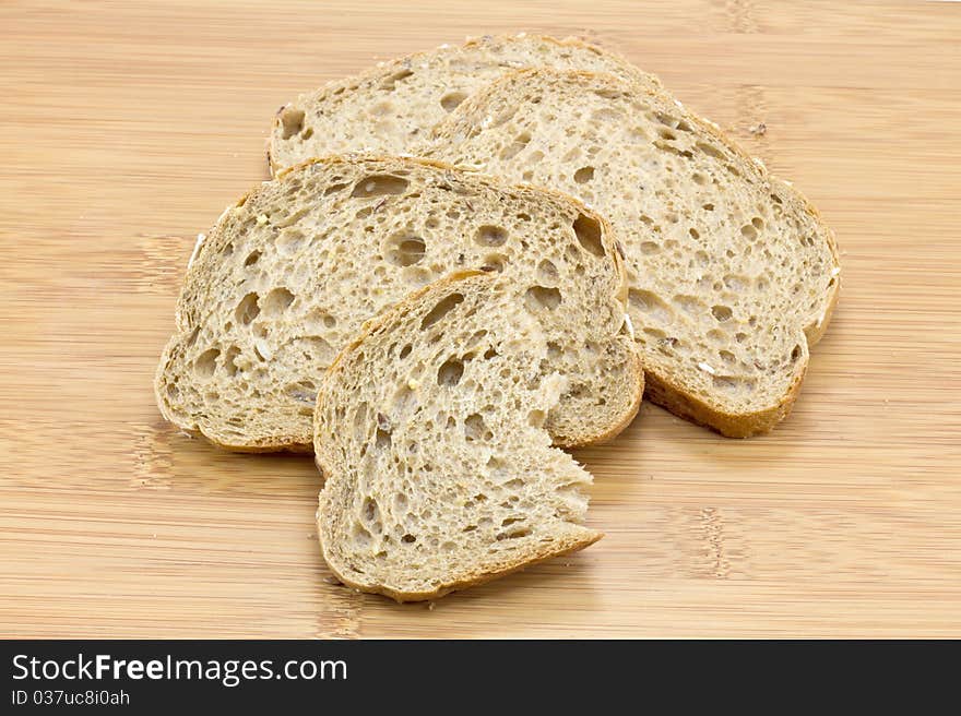 Sliced bread on wooden background