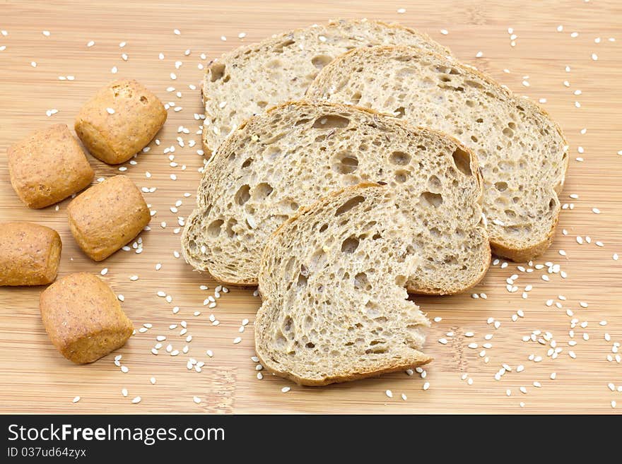 Sliced bread on wooden background