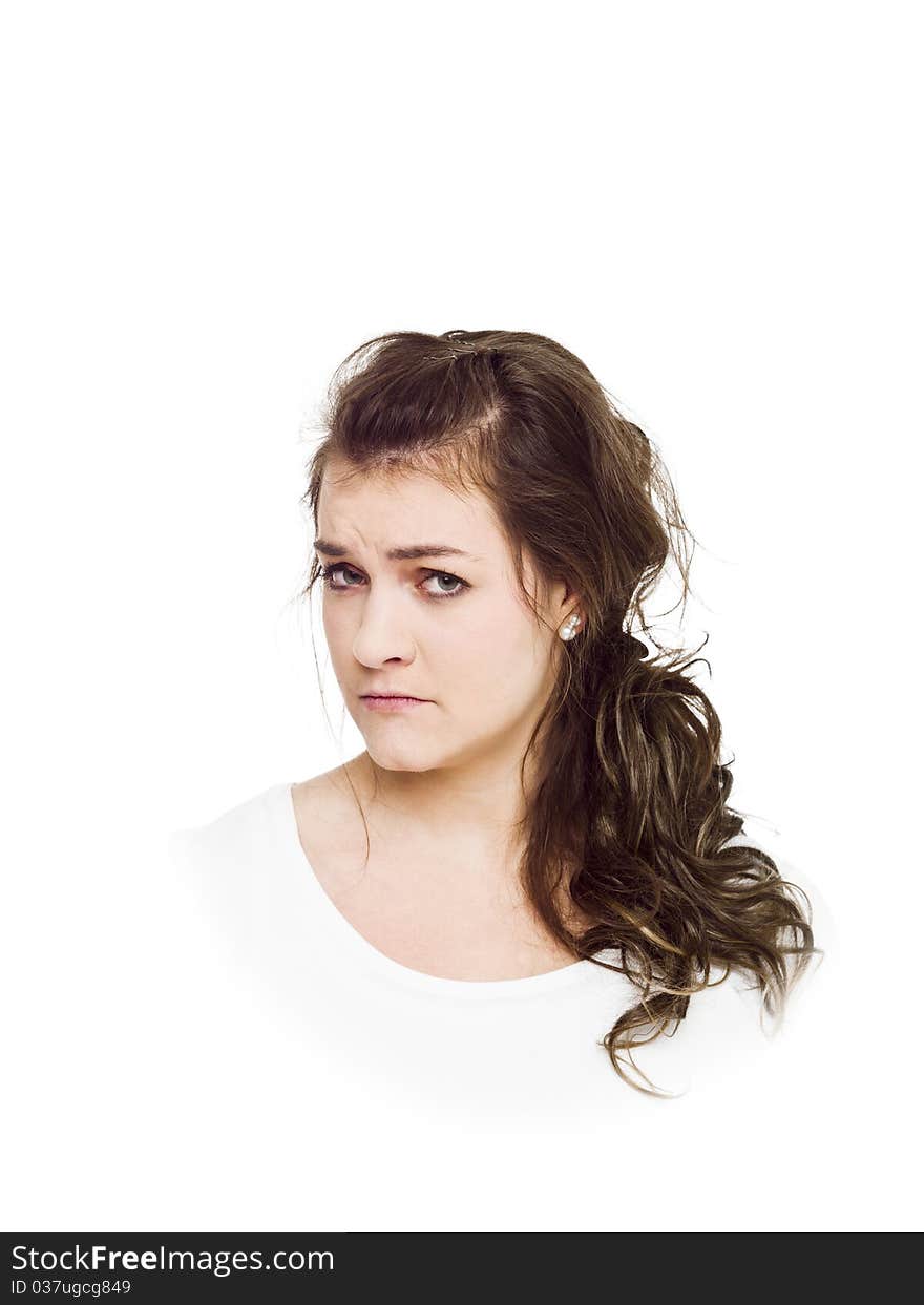 Young serious woman on white background