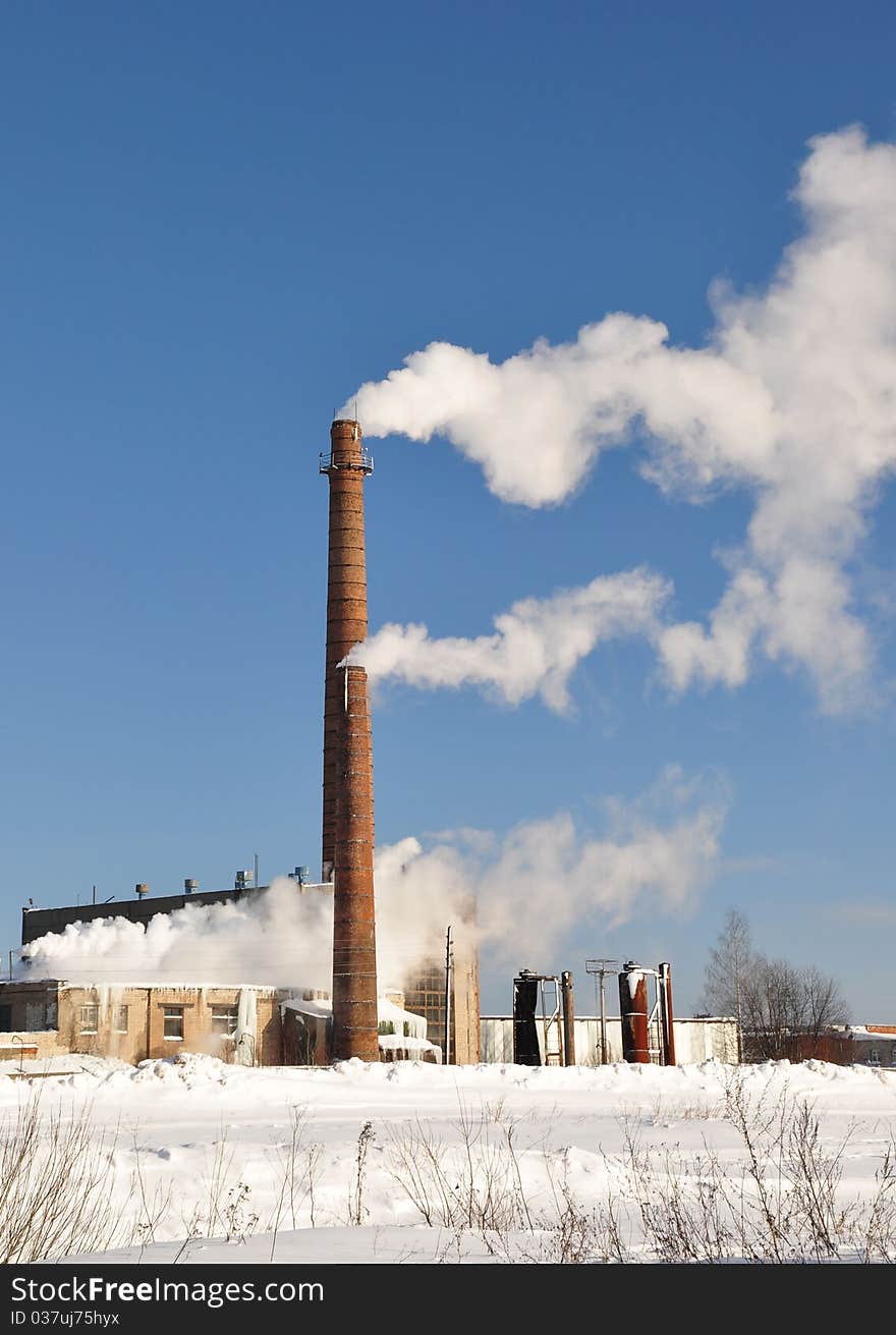 Two Smoking chimneys. Plant. Winter. Two Smoking chimneys. Plant. Winter.