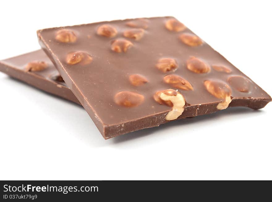 Chocolate with nuts on white background