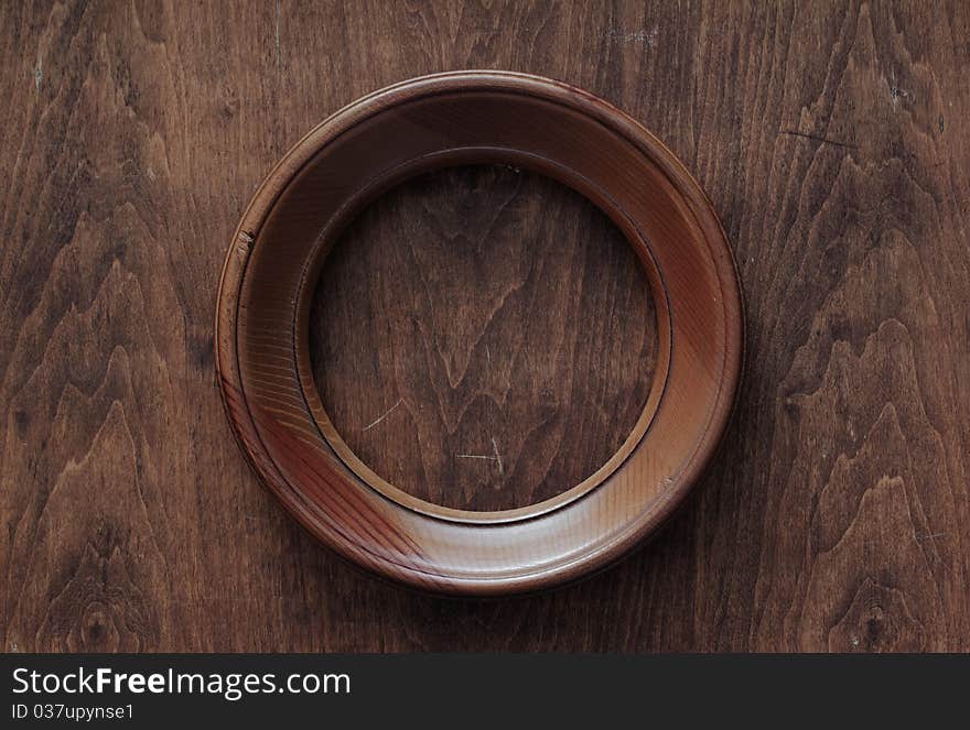 Blank frame on old wooden background