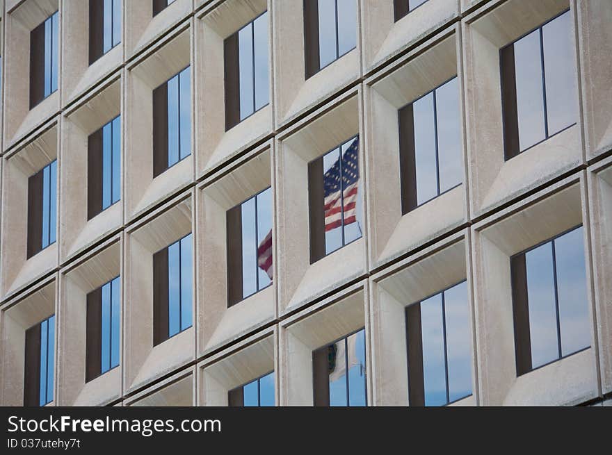 American Flag Reflected in Business Building