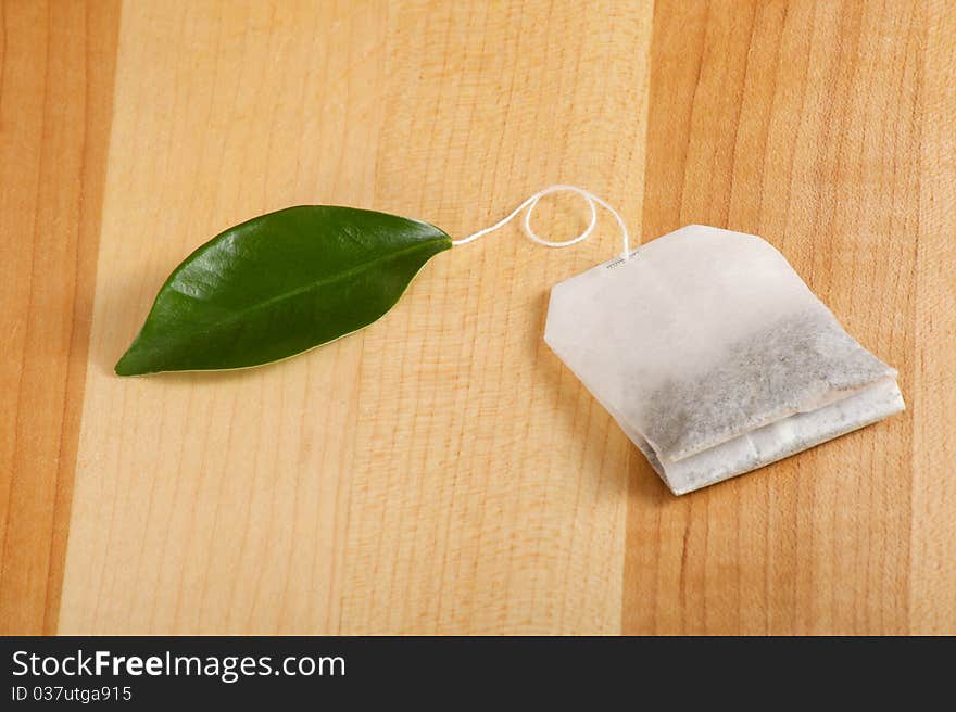 Natural herbal drink with a leaf for the teabag tag. Natural herbal drink with a leaf for the teabag tag