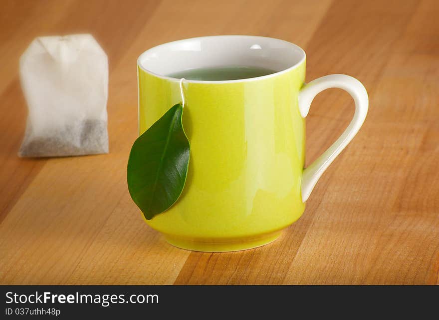 Natural herbal drink with a leaf for the teabag tag. Natural herbal drink with a leaf for the teabag tag