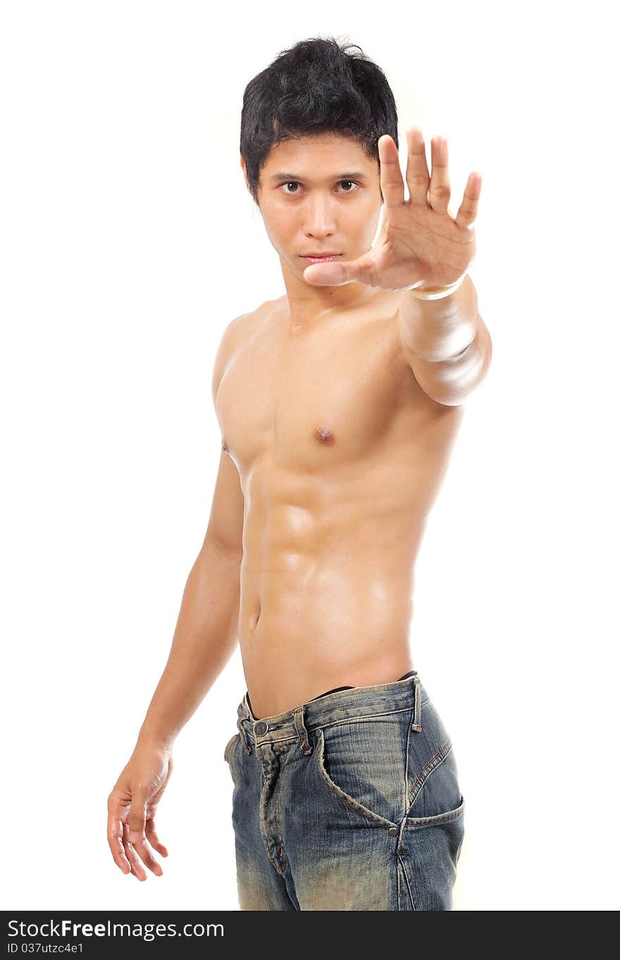 Young muscular man showing his palm into camera. Young muscular man showing his palm into camera