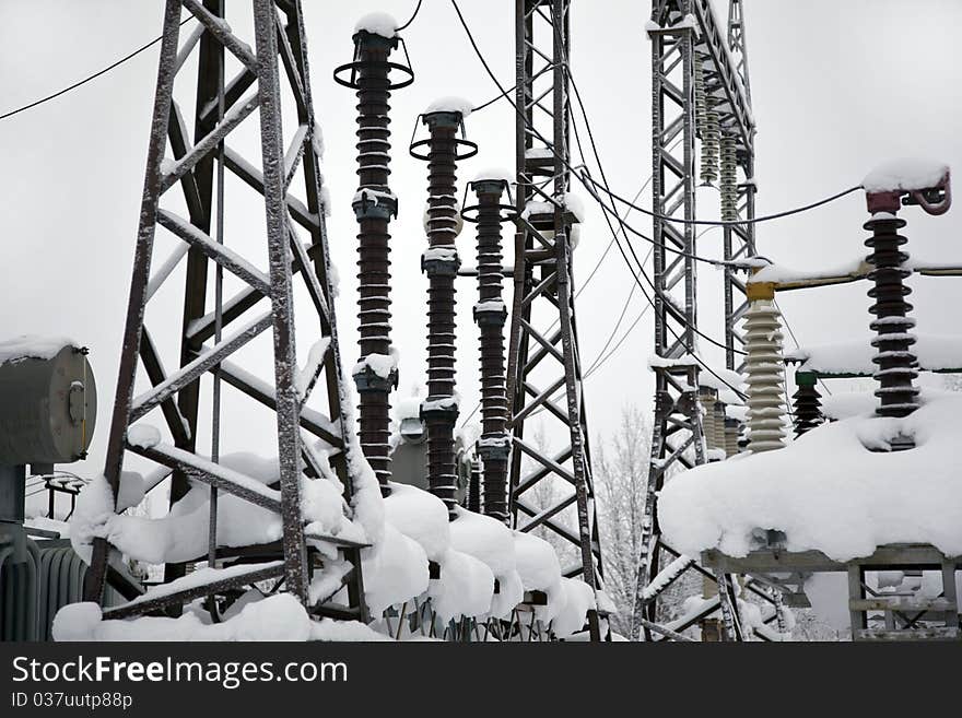 Electrical substation in the snowdrifts. winter landscape