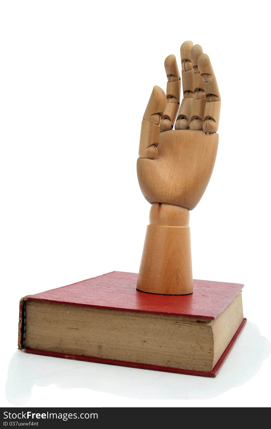 The wooden hand and old book. The wooden hand and old book