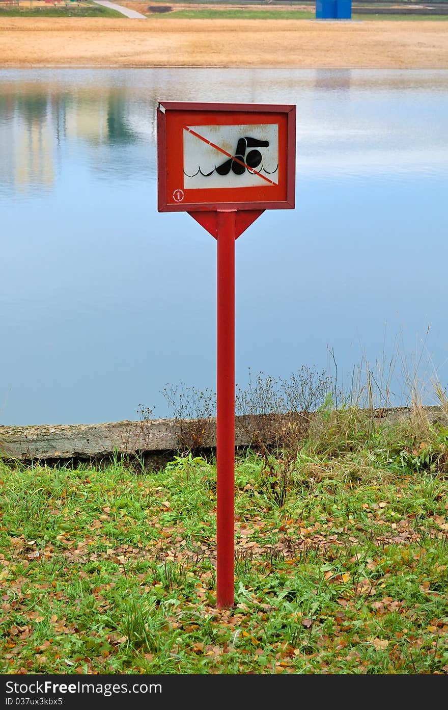 No swimming sign looking out to the pond