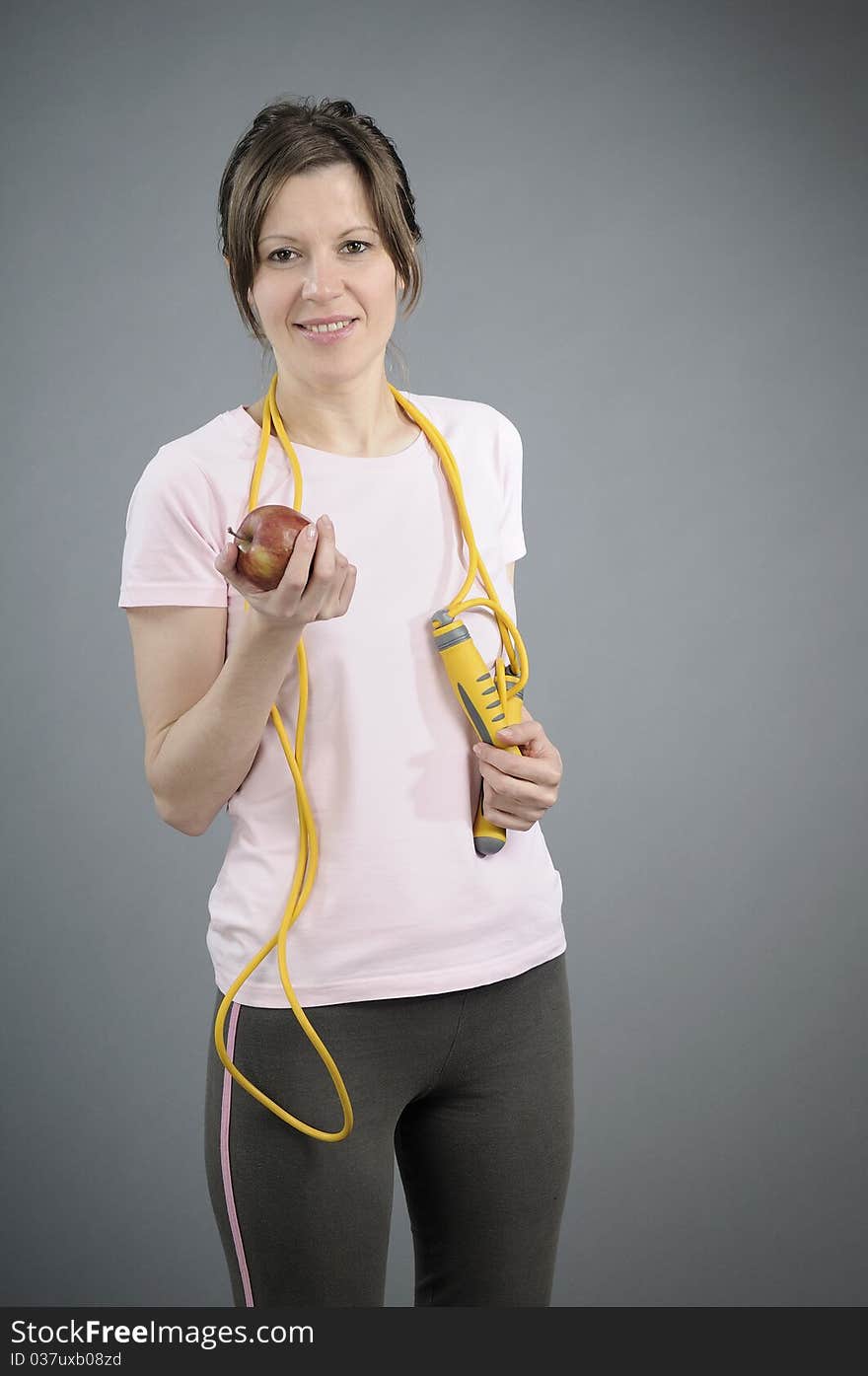 Girl eating red fruit