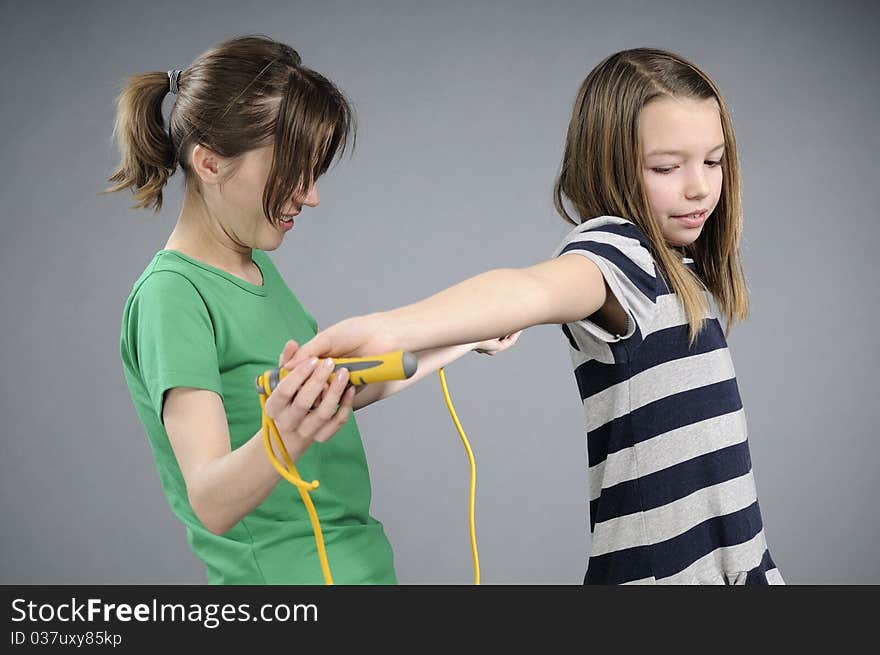 White woman teaching pretty girl jumping rope movements. White woman teaching pretty girl jumping rope movements