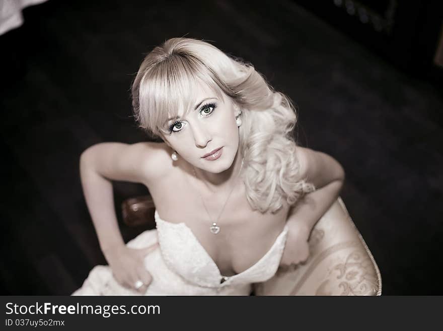 Attractive young woman sitting on a chair