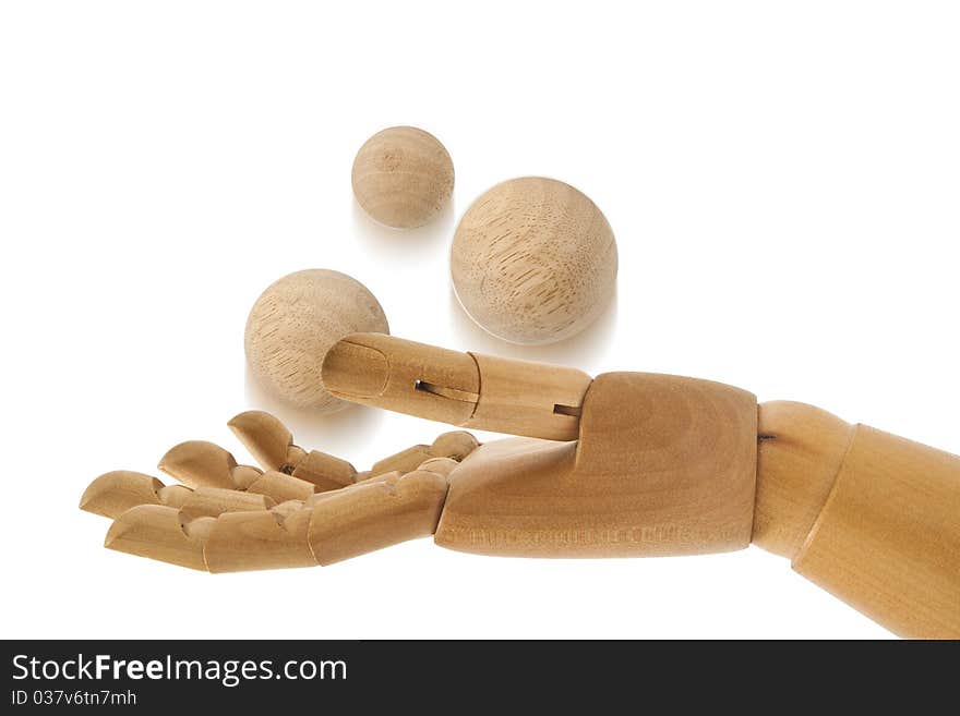 Three wooden balls on wooden hand. Three wooden balls on wooden hand