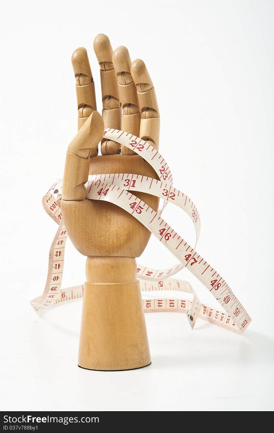 The Wooden hand and tape. The Wooden hand and tape