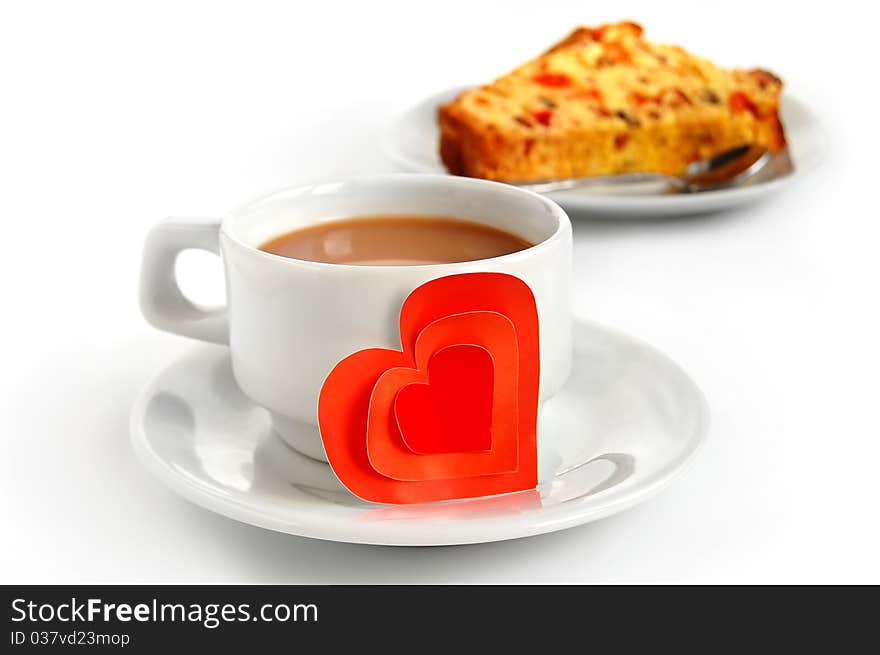 A cup of coffee and a piece of cake in the Valentine's Day. A cup of coffee and a piece of cake in the Valentine's Day