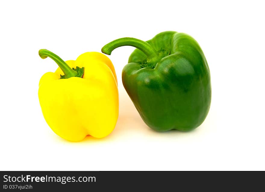 Green and yellow paprika isolated on white background. Green and yellow paprika isolated on white background.