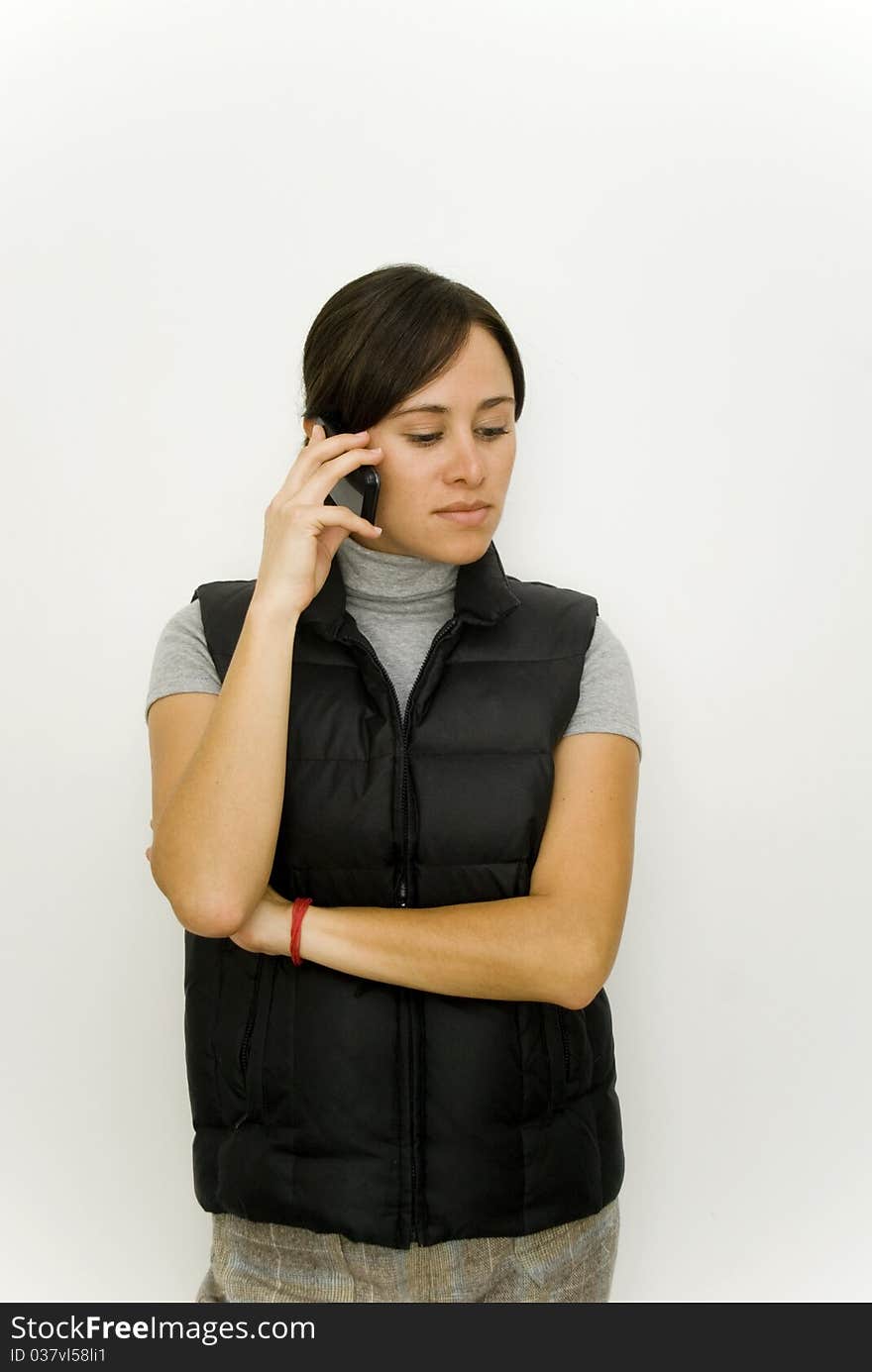 Young woman talking on mobile phone. Young woman talking on mobile phone