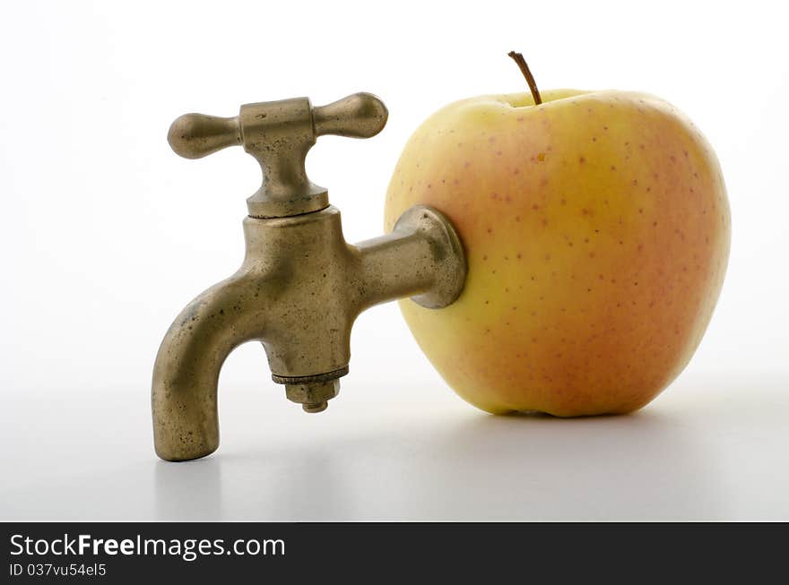 Apple with an old brass faucet. Apple with an old brass faucet