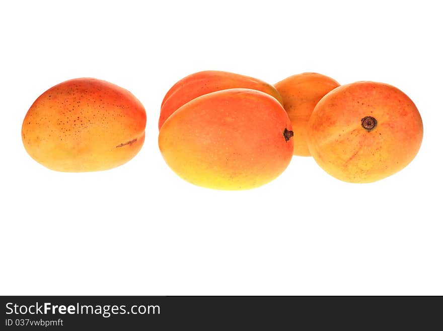 Group of fresh mangoes isolated over white