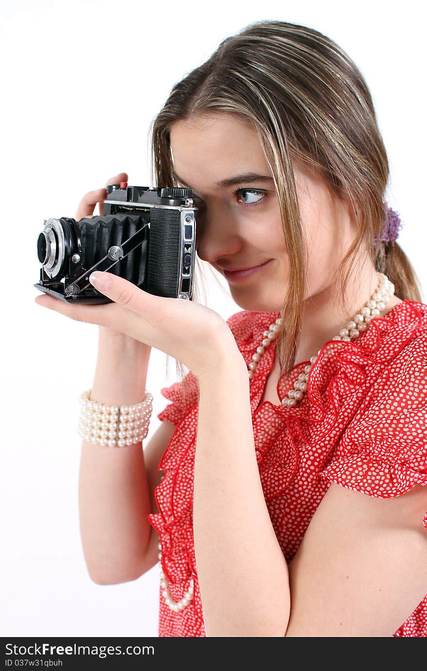 Woman taking a picture with a vintage camera. Woman taking a picture with a vintage camera