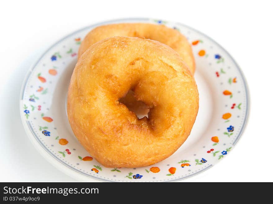 Donut In Dish On White Background