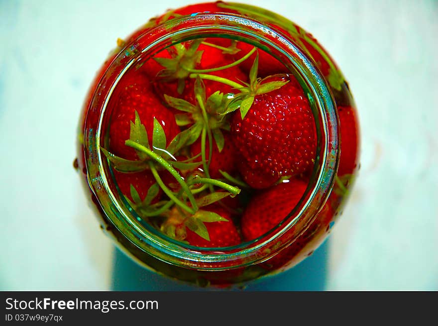 Strawberry in bank with water against