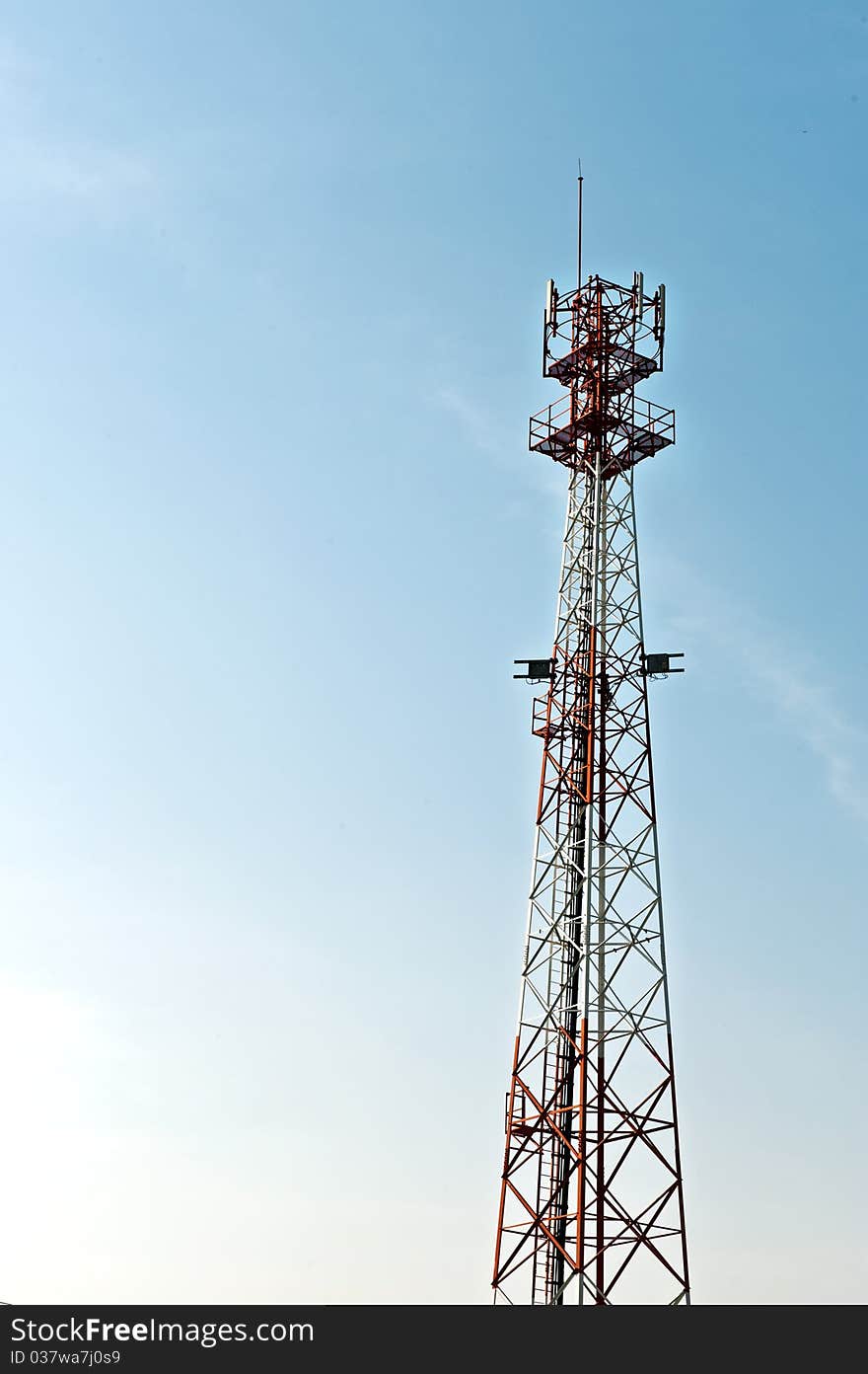 Communication tower over a blue sky. Communication tower over a blue sky.