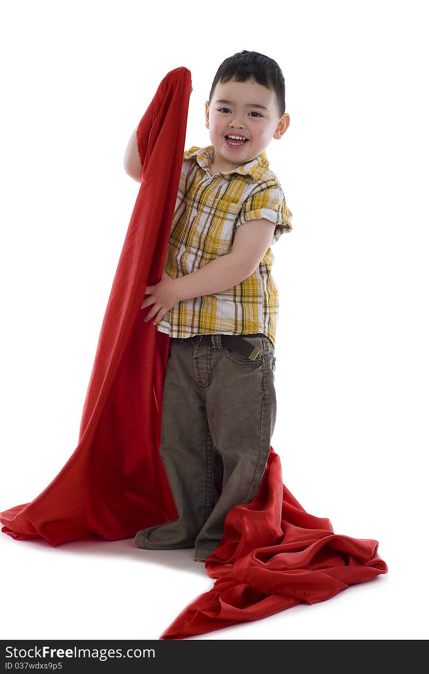 Happy little boy with red silk fabric, isolated on white background